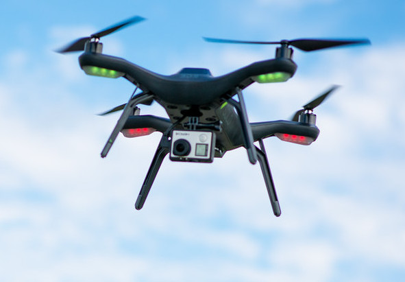 Greg Betz and students fly a drone at Recreation East